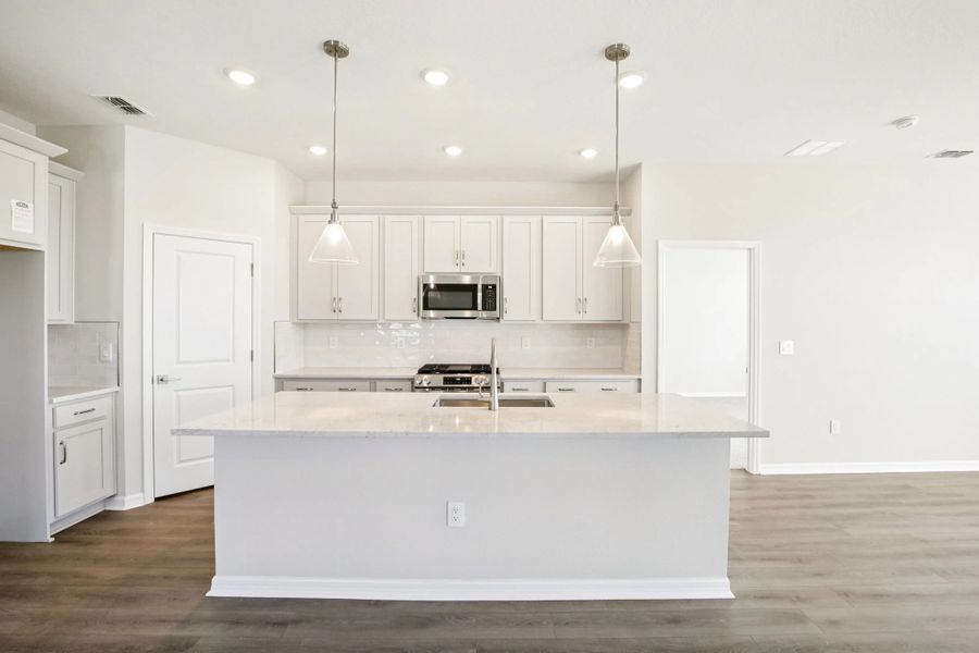 Gorgeous kitchen featuring a large island and the AW Collection® Milan
