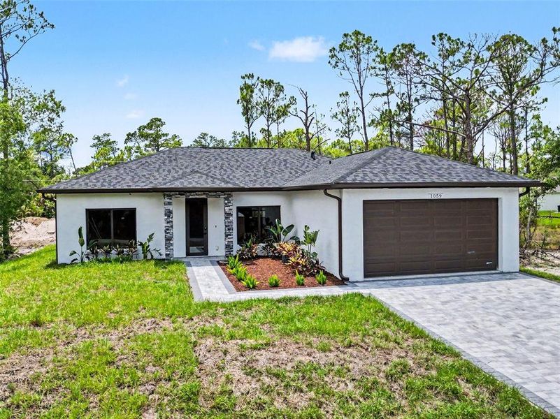 Front exterior of a new home in , Port Charlotte, FL, highlighting curb appeal (Image 2). Front exterior of a new home in , Port Charlotte, FL, highlighting curb appeal (Image 2).
