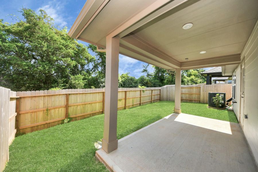 Exterior details and patio area of a home in Montgomery Ridge: Landmark Collection, Montgomery (Image 26).