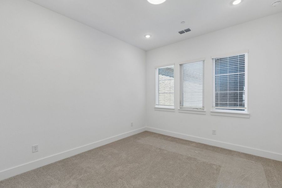 Representative unfurnished interior of a home built from the Roosevelt by Centre Living Homes in Newman Village Townhomes, Frisco (Image 21).