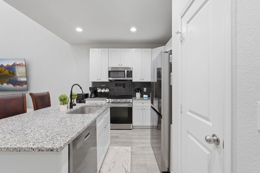 Furnished interior view inside a new home in Arrowhead Lakes, Willis (Image 11).
