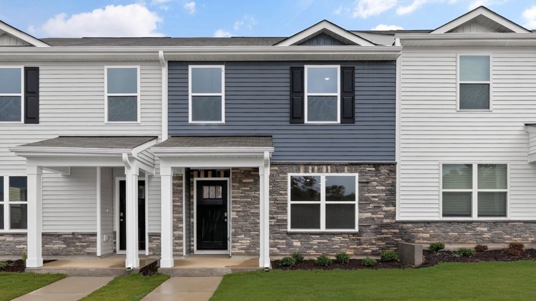 Representative exterior photo of a completed home built from the Pearson ll by D.R. Horton in The Townes at Matthews Landing, Fuquay Varina, NC (Image 24).