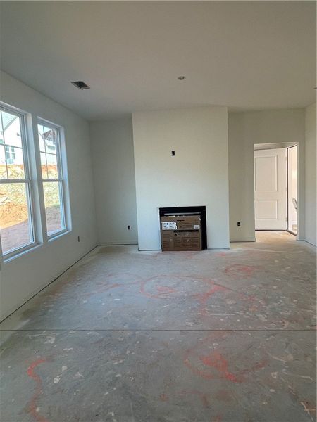 This living area features high ceilings and ample This living area features high ceilings and ample