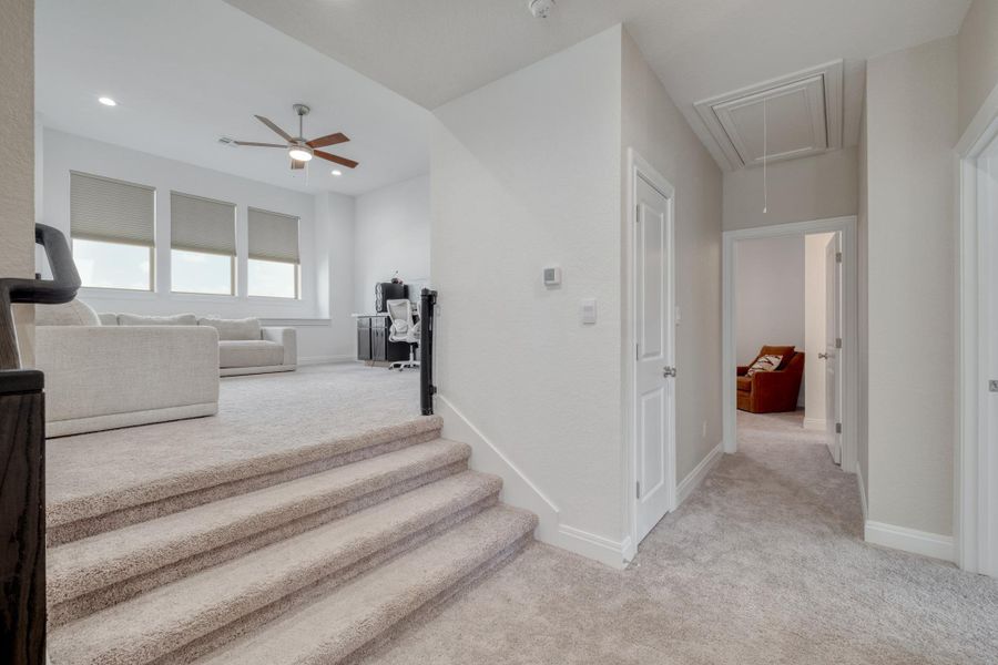 A few steps lead to the elevated game room, giving it a fun sense of separation from the bedrooms.