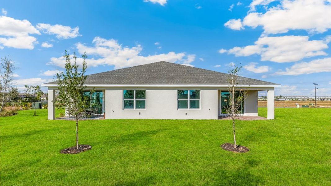 Exterior details and patio area of a home in Cove at West Port - Express, Port Charlotte (Image 4).