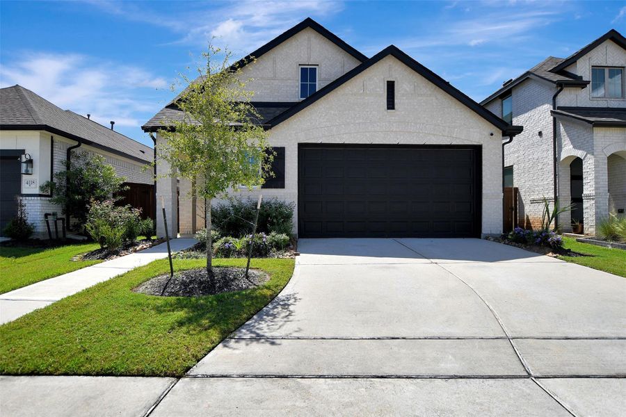 Front exterior of a new home in , Arcola, TX, highlighting curb appeal (Image 1). Front exterior of a new home in , Arcola, TX, highlighting curb appeal (Image 1).