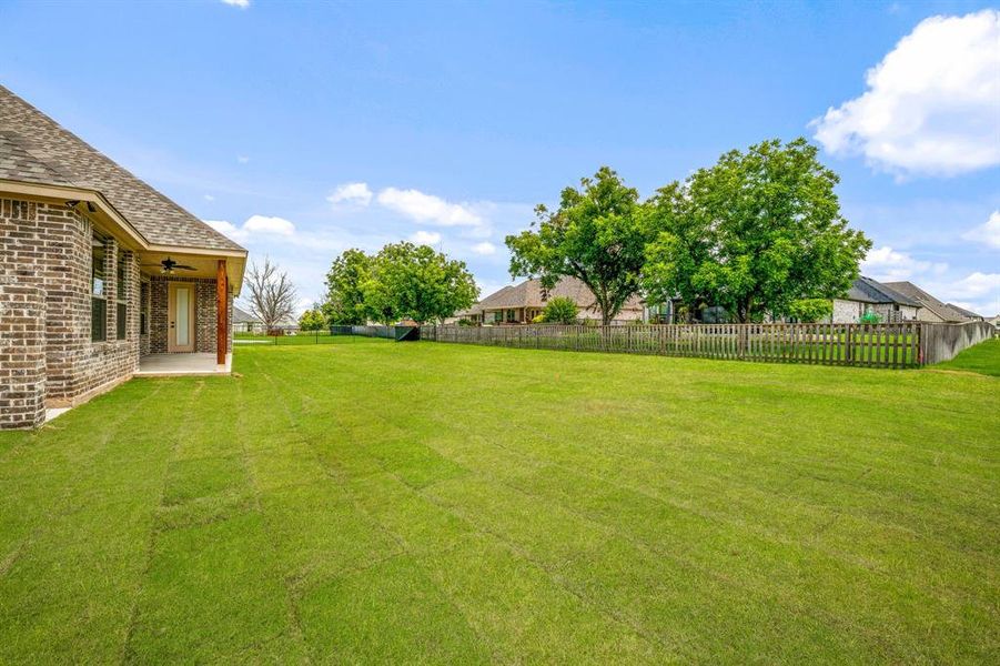 Exterior details and patio area of a home in Pecan Plantation, Granbury (Image 24).