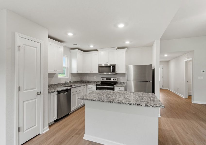 The kitchen overlooks the dining area