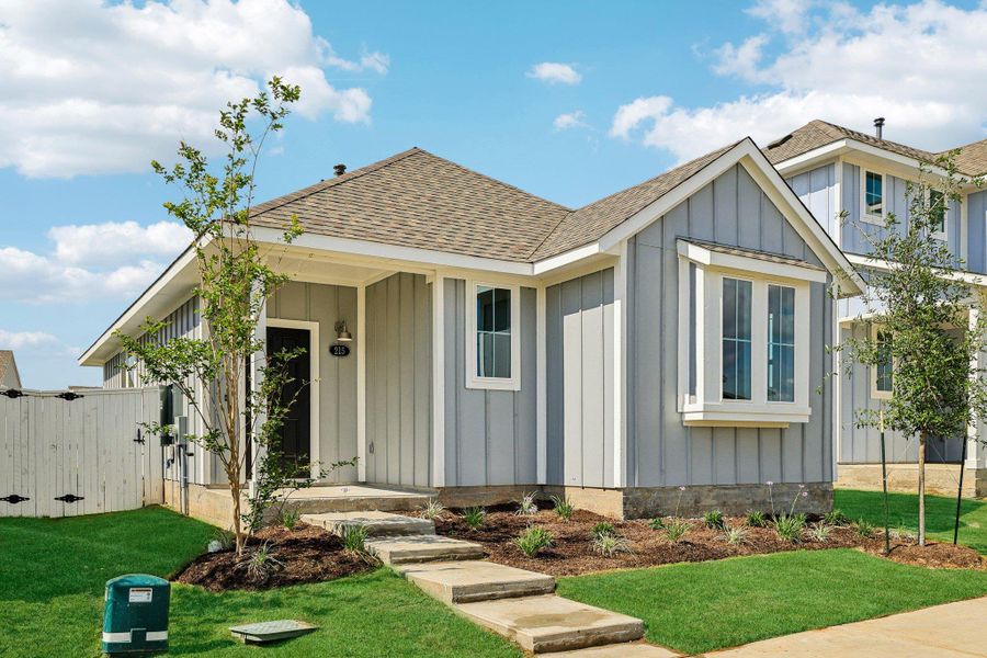 Front exterior of a new home in Harvest Ridge, Elgin, TX, highlighting curb appeal (Image 18). Front exterior of a new home in Harvest Ridge, Elgin, TX, highlighting curb appeal (Image 18).