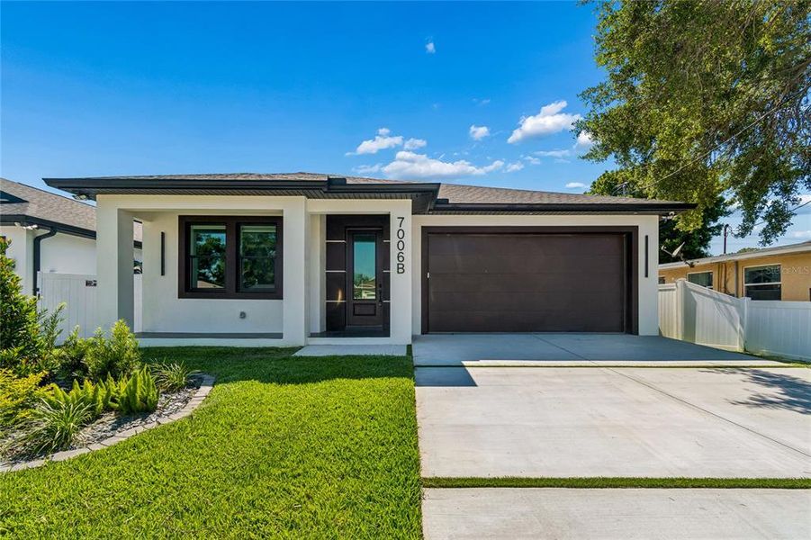 Front exterior of a new home in , Tampa, FL, highlighting curb appeal (Image 29).