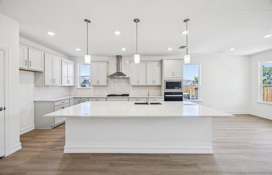Spacious kitchen with eat-in bartop island Spacious kitchen with eat-in bartop island