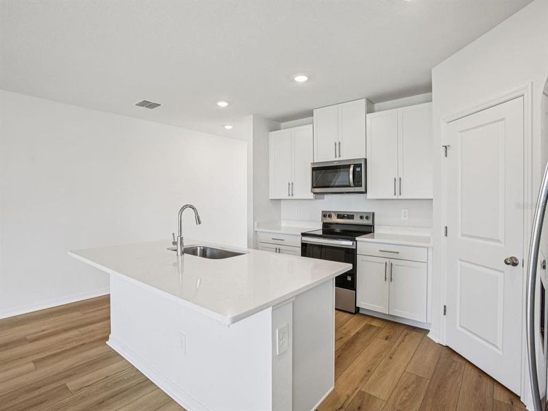 Furnished interior view inside a new home in The Grove at Stuart Crossing - Classic Series, Bartow (Image 11).