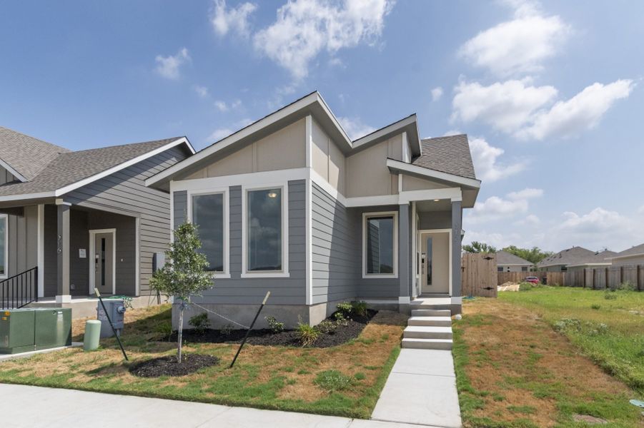 Front exterior of a new home in Blanco Vista, San Marcos, TX, highlighting curb appeal (Image 22).