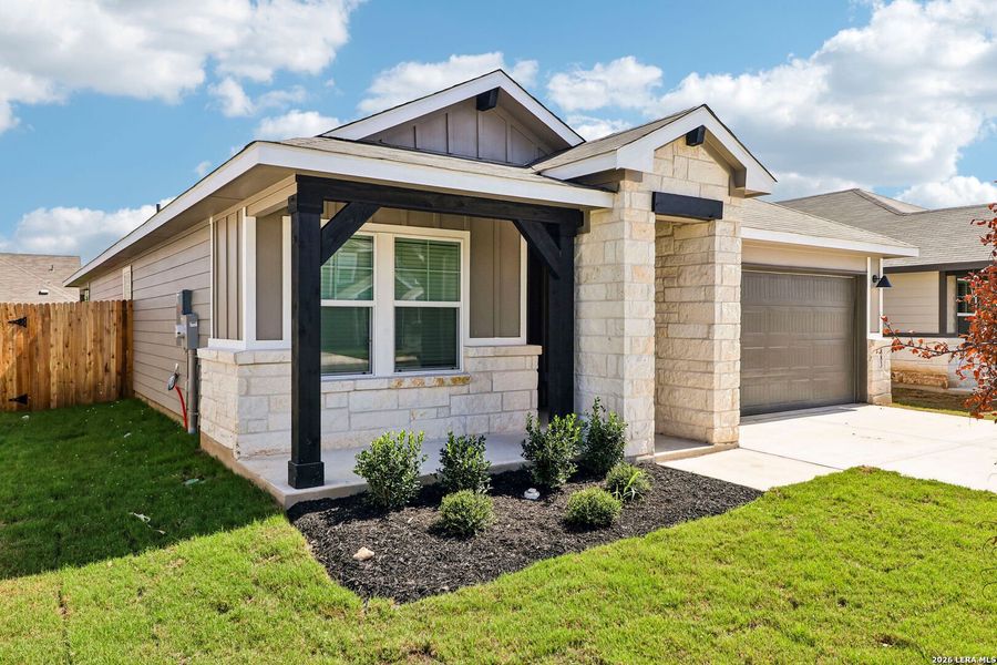 Front exterior of a new home in Estancia Ranch - Premier Series, San Antonio, TX, highlighting curb appeal (Image 1). Front exterior of a new home in Estancia Ranch - Premier Series, San Antonio, TX, highlighting curb appeal (Image 1).