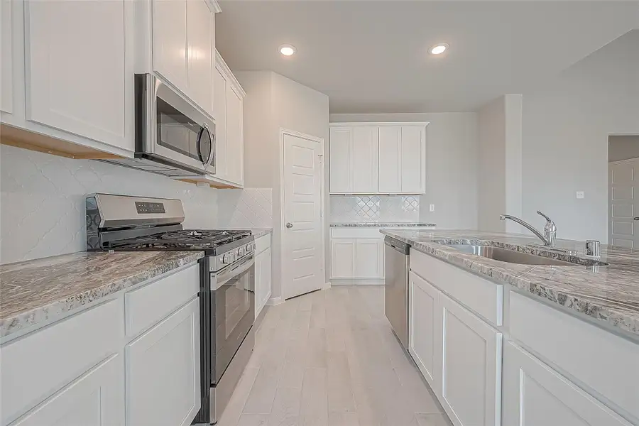 Furnished interior view inside a new home in Mill Creek Trails, Magnolia (Image 6).