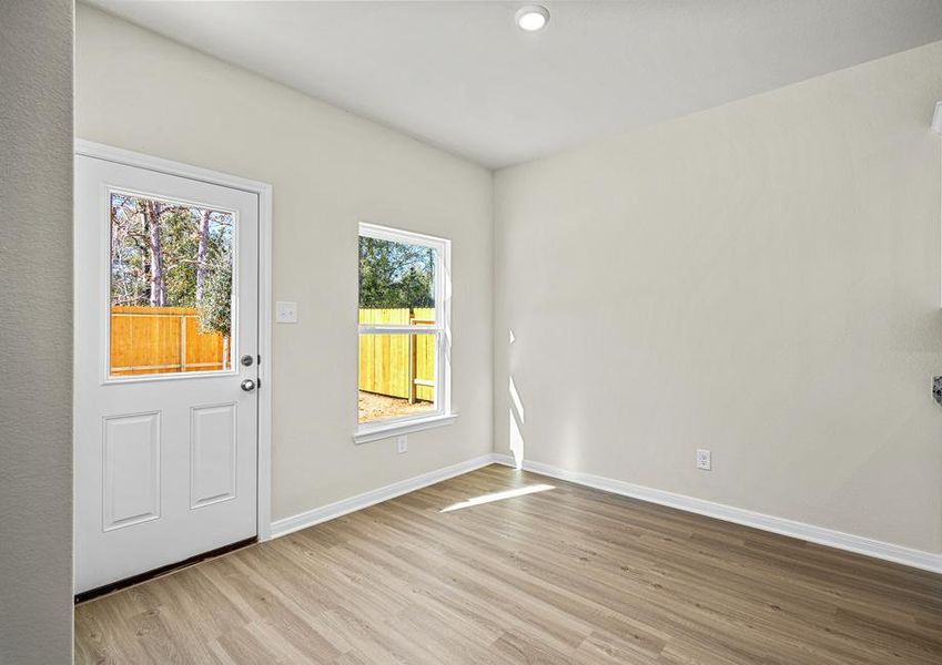 A door in the dining room that leads to the back covered patio.