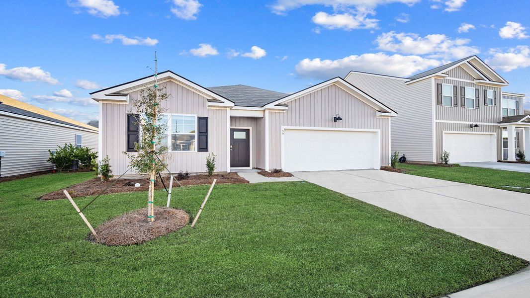 Front exterior of a new home in The Lakes at North Glynn, Brunswick, GA, highlighting curb appeal (Image 2).