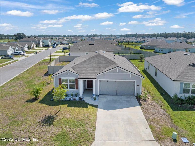 Front exterior of a new home in Dorado at Entrada, St. Augustine, FL, highlighting curb appeal (Image 22). Front exterior of a new home in Dorado at Entrada, St. Augustine, FL, highlighting curb appeal (Image 22).