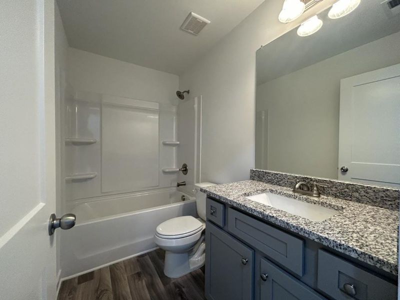 Furnished interior view inside a new home in Sutton's Landing, Statham (Image 4).