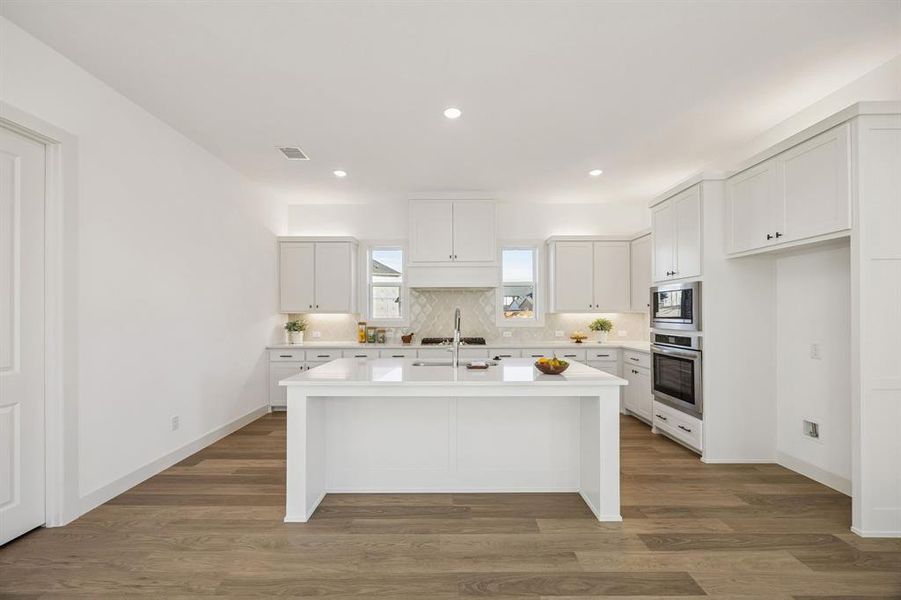 The spacious island is the hub of your new dream kitchen!