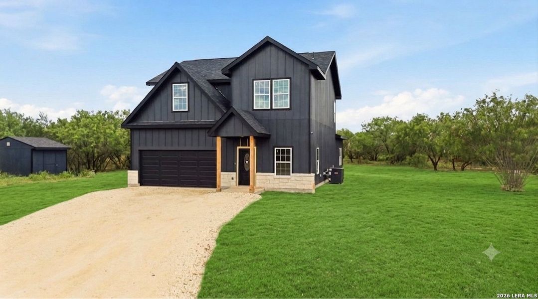 Front exterior of a new home in , Devine, TX, highlighting curb appeal (Image 30).