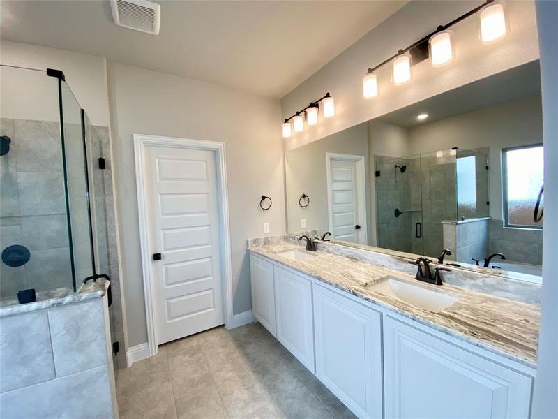 Dual sinks with Fantasy Brown granite vanity