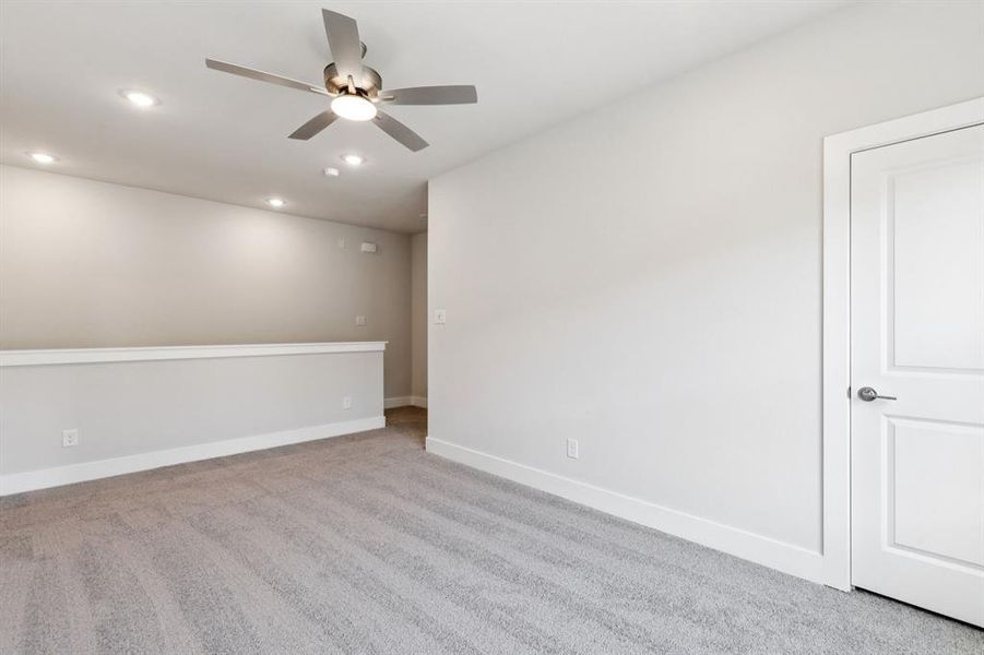 Carpeted empty room featuring recessed lighting and a ceiling fan Carpeted empty room featuring recessed lighting and a ceiling fan