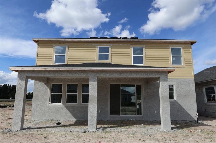 Exterior details and patio area of a home in Center Lake on the Park, St. Cloud (Image 17).