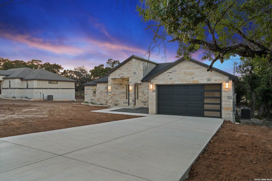 Front exterior of a new home in , Spring Branch, TX, highlighting curb appeal (Image 22). Front exterior of a new home in , Spring Branch, TX, highlighting curb appeal (Image 22).