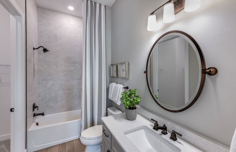 Secondary bathroom with tub and shower combination