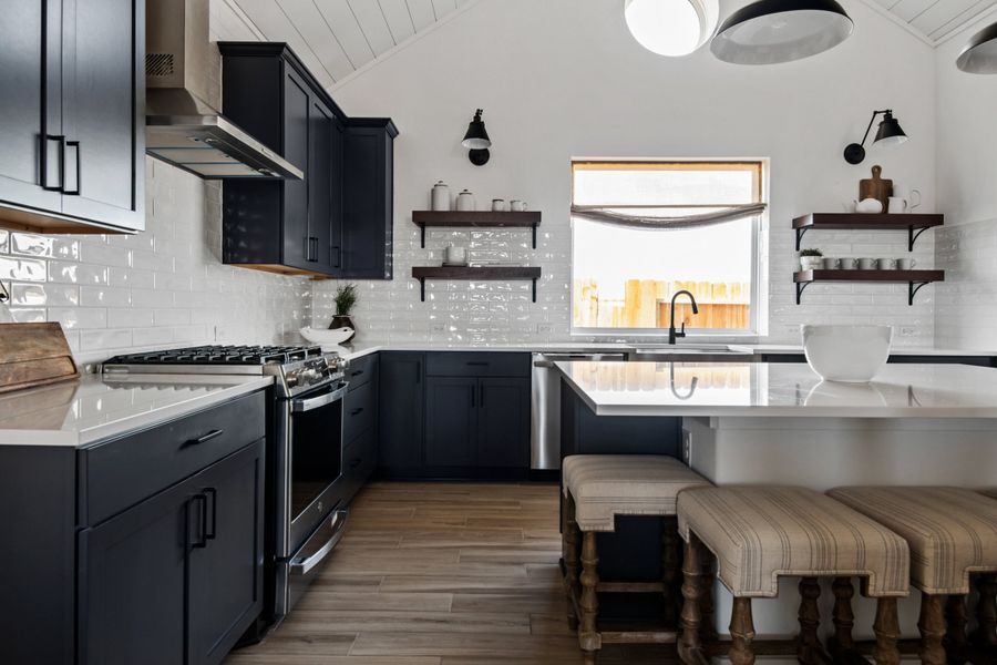 Kitchen with subway tile and island