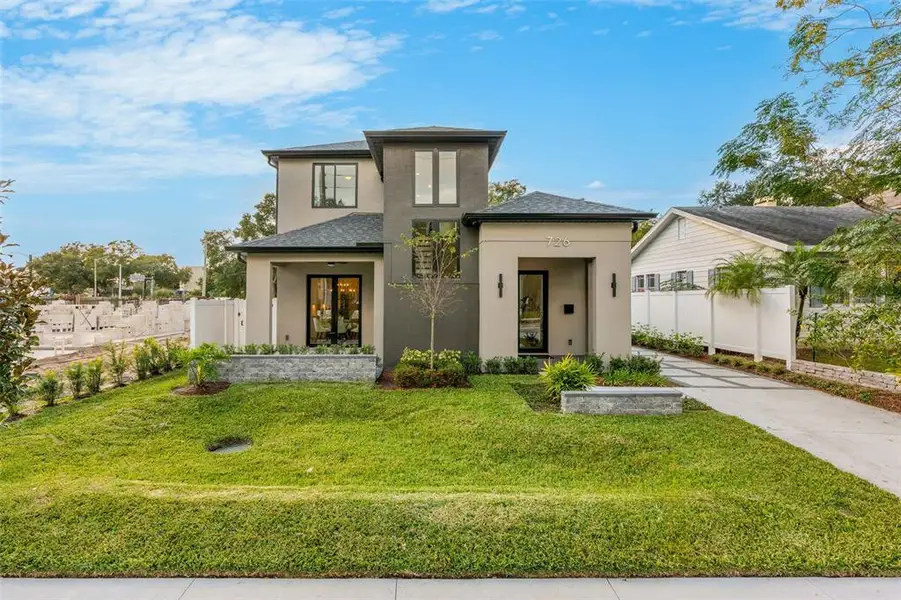 Front exterior of a new home in , Orlando, FL, highlighting curb appeal (Image 1). Front exterior of a new home in , Orlando, FL, highlighting curb appeal (Image 1).