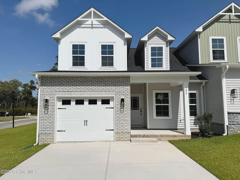 Front exterior of a new home in Autumn Trail, Bolivia, NC, highlighting curb appeal (Image 2). Front exterior of a new home in Autumn Trail, Bolivia, NC, highlighting curb appeal (Image 2).