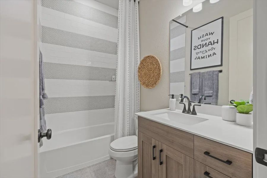 Representative furnished interior of a home built from the Malani by Chesmar Homes in Lakes of Cane Island, Katy (Image 18).