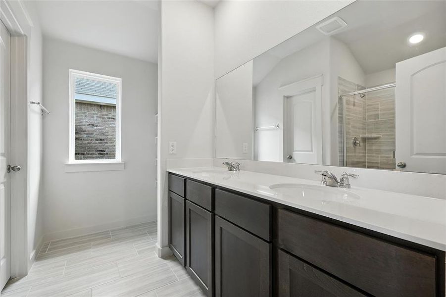 Bathroom with double vanity and a tile shower Bathroom with double vanity and a tile shower