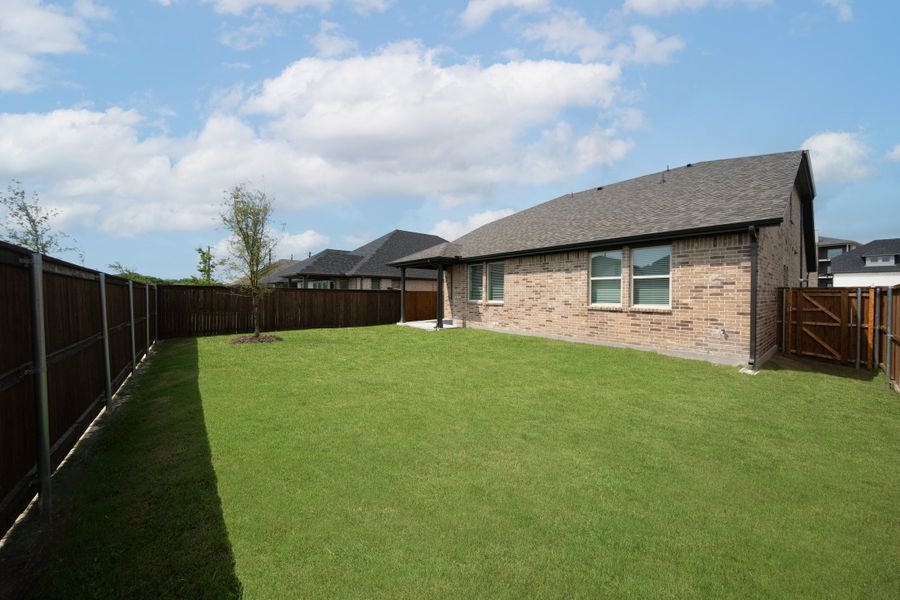 Exterior details and patio area of a home in Whitewing Trails, Princeton (Image 2).