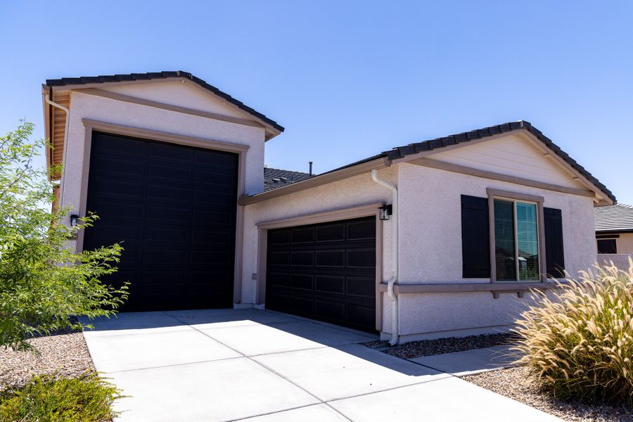 Front exterior of a new home in Rancho Mirage, Maricopa, AZ, highlighting curb appeal (Image 23). Front exterior of a new home in Rancho Mirage, Maricopa, AZ, highlighting curb appeal (Image 23).
