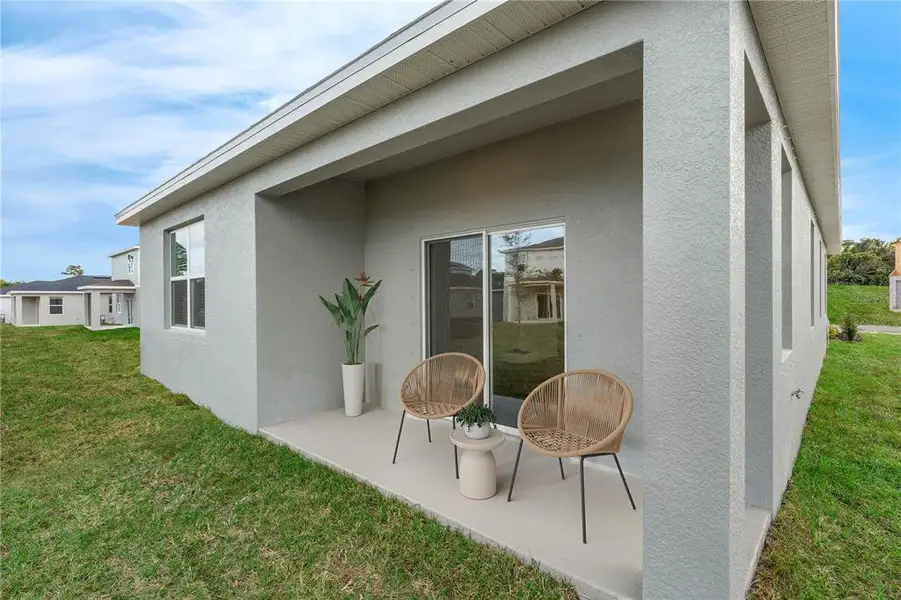 Exterior details and patio area of a home in Wynnstone, Davenport (Image 3).