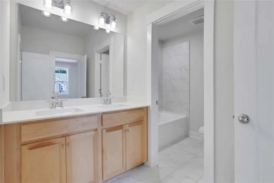 Furnished interior view inside a new home in The Paddocks at Doc Hughes, Buford (Image 6).