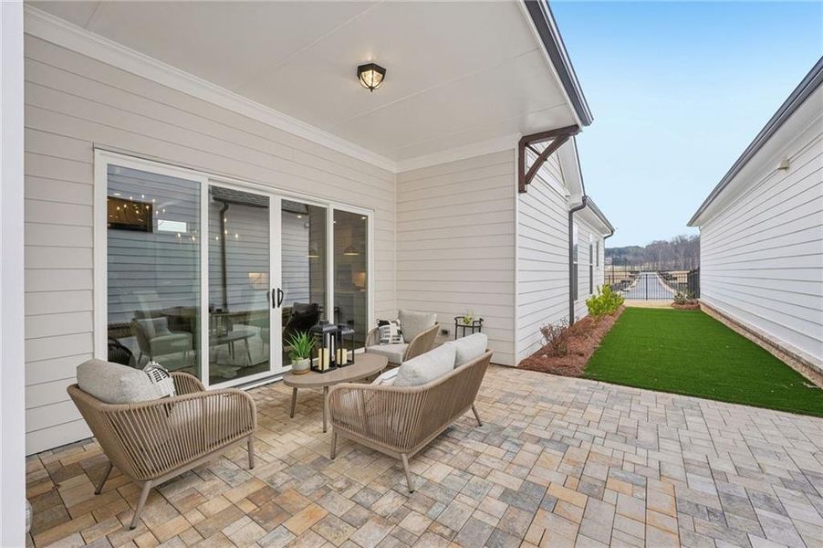 Exterior details and patio area of a home in Promenade at Sawnee Village, Cumming (Image 23).