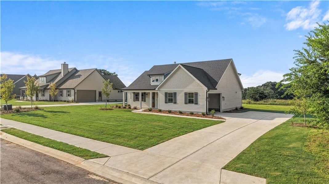 Front exterior of a new home in , Madison, GA, highlighting curb appeal (Image 29). Front exterior of a new home in , Madison, GA, highlighting curb appeal (Image 29).