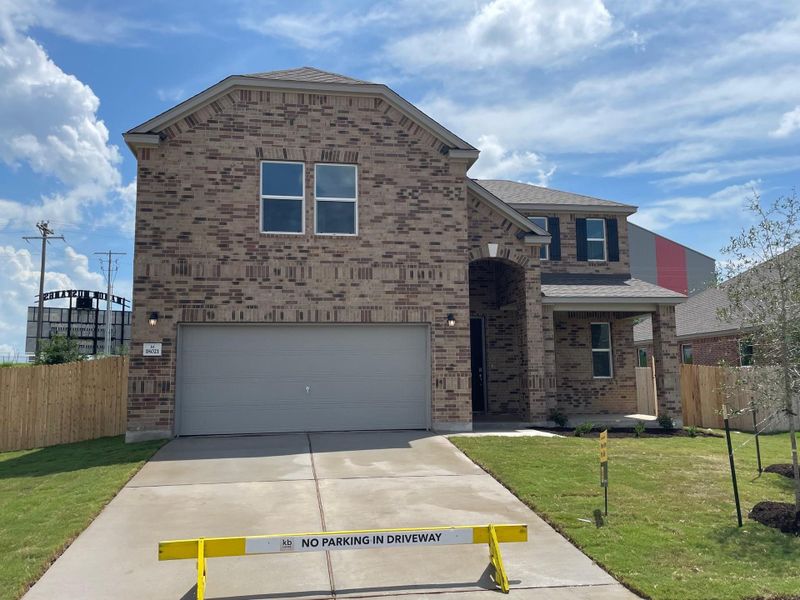 Front exterior of a new home in Mustang Valley, Manor, TX, highlighting curb appeal (Image 1). Front exterior of a new home in Mustang Valley, Manor, TX, highlighting curb appeal (Image 1).