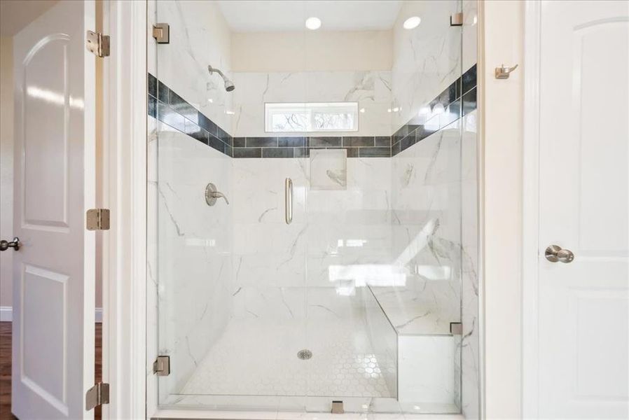 Bathroom with a shower with door