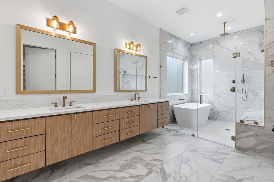 Finishes and a floating wood vanity create an elegant, spa-like atmosphere.