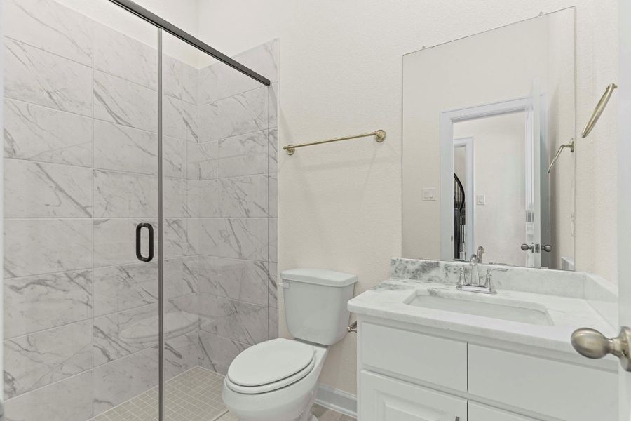 The Guest Bathroom downstairs features a beautiful walk-in shower with seamless shower door, gorgeous tile surroundings, Upgrade bathroom countertop with deep undermount sink and the Elongated water saver commodes are in all the bathrooms. The Guest Bathroom downstairs features a beautiful walk-in shower with seamless shower door, gorgeous tile surroundings, Upgrade bathroom countertop with deep undermount sink and the Elongated water saver commodes are in all the bathrooms.