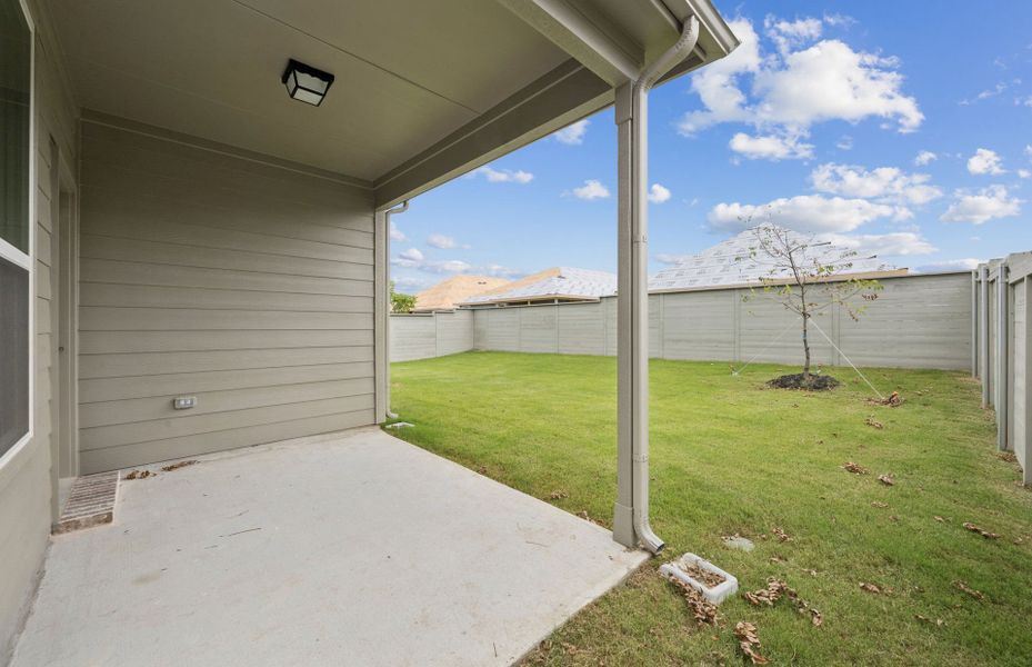 Oversized yard with covered patio *Real home pictured