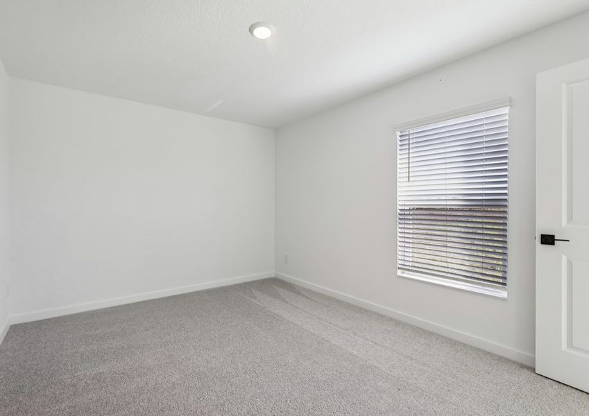 Rest and relaxation await in the master bedroom