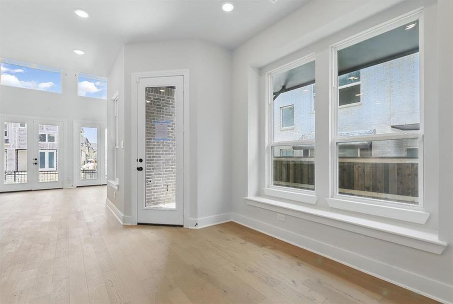 Unfurnished dining area with recessed lighting and light wood finished floors