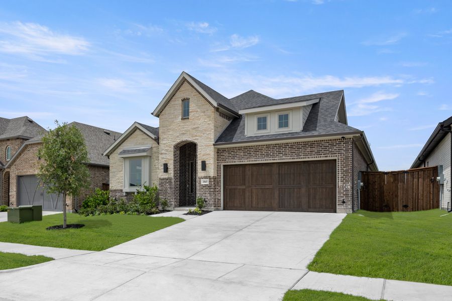 Front exterior of a new home in Bridgewater, Midlothian, TX, highlighting curb appeal (Image 2). Front exterior of a new home in Bridgewater, Midlothian, TX, highlighting curb appeal (Image 2).