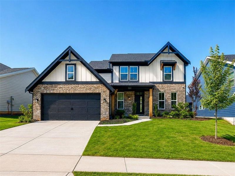 Front exterior of a new home in The Reserve At Liberty Park, Braselton, GA, highlighting curb appeal (Image 2). Front exterior of a new home in The Reserve At Liberty Park, Braselton, GA, highlighting curb appeal (Image 2).